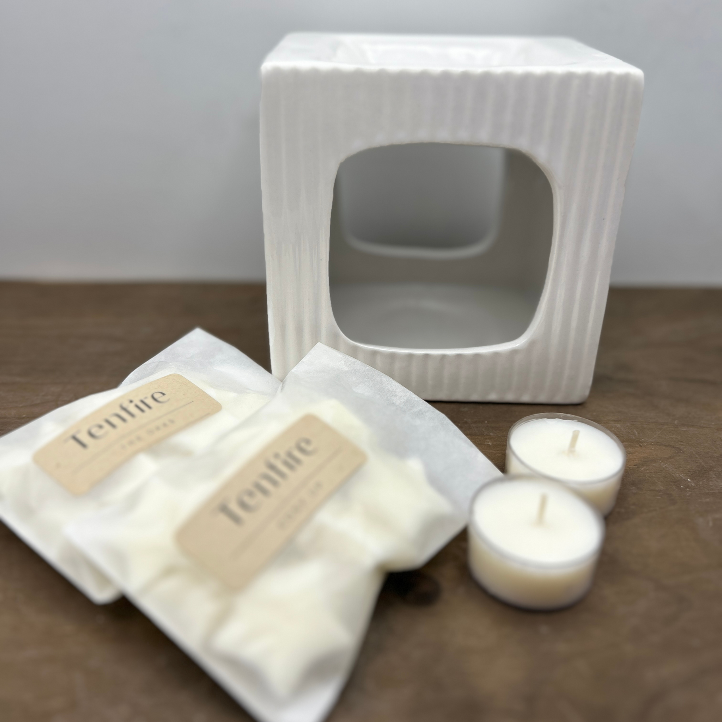 Square ribbed wax melt burner with two bags of wax melts and two tealights