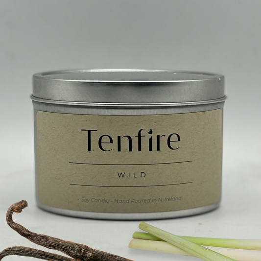 soy wax candle tin called Wild with vanilla pod and lemongrass in the forefront