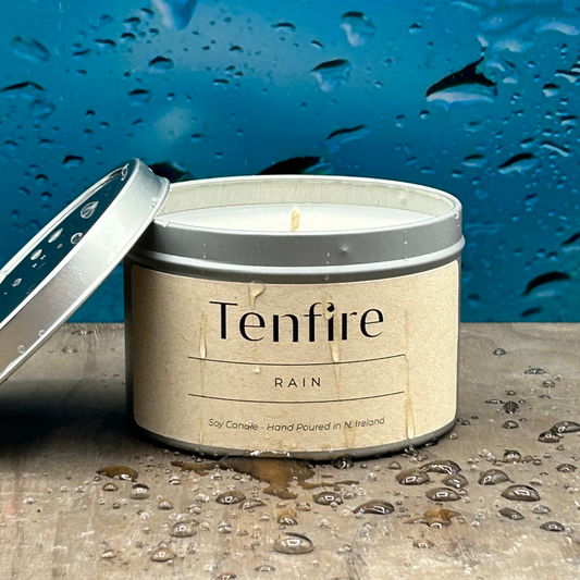 open soy wax candle called rain covered with rain drops 