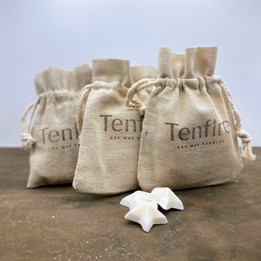 three linen bags stamped with the name Tenfire an three wax melt stars in front