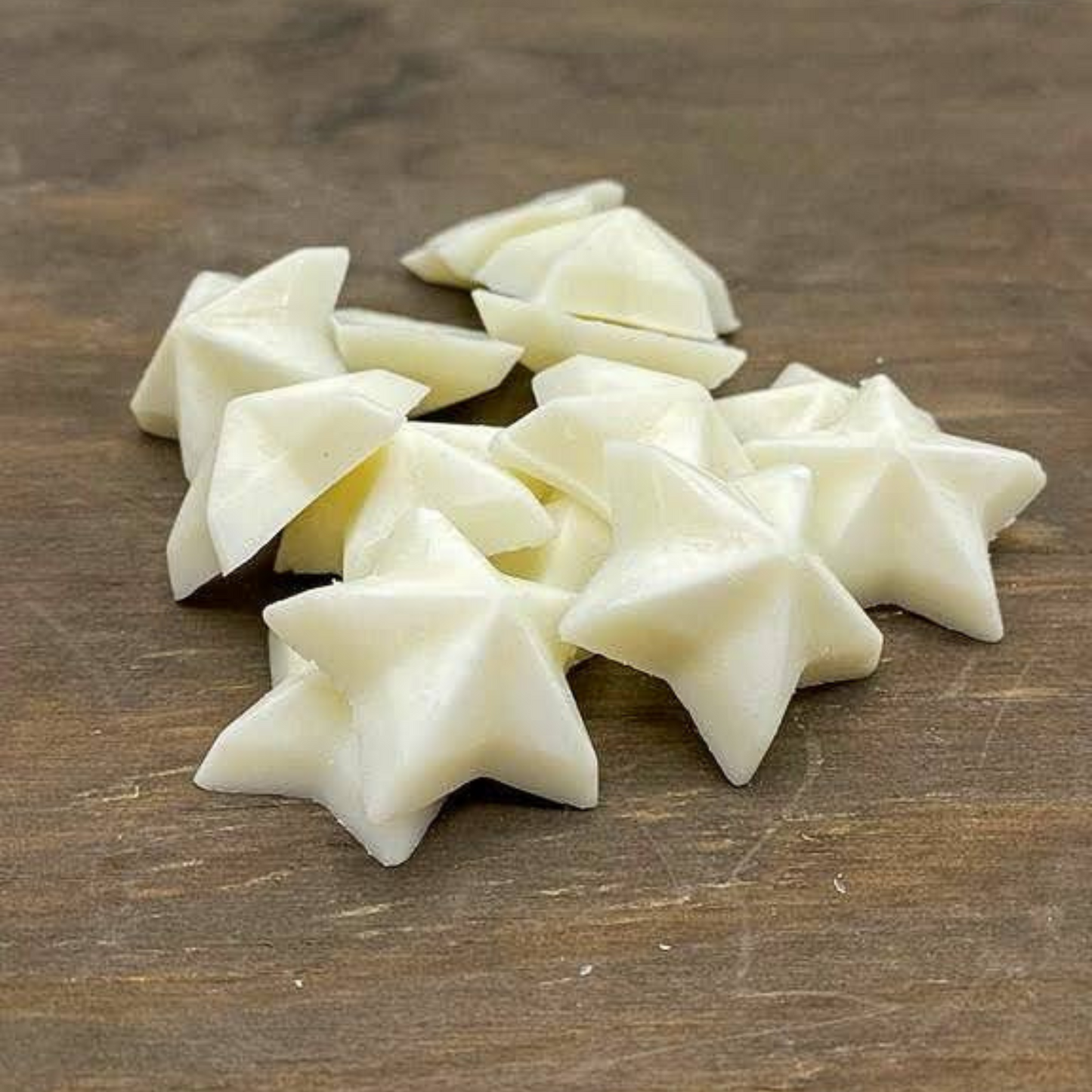 star shaped wax melts loose on a piece of wood